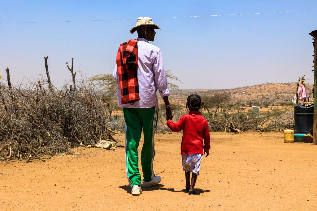 Joseph walking with daughter