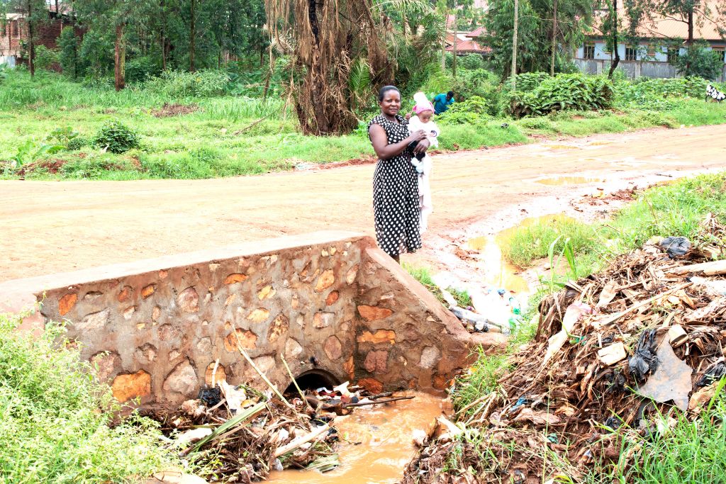 Gladys and Miracle by a drain