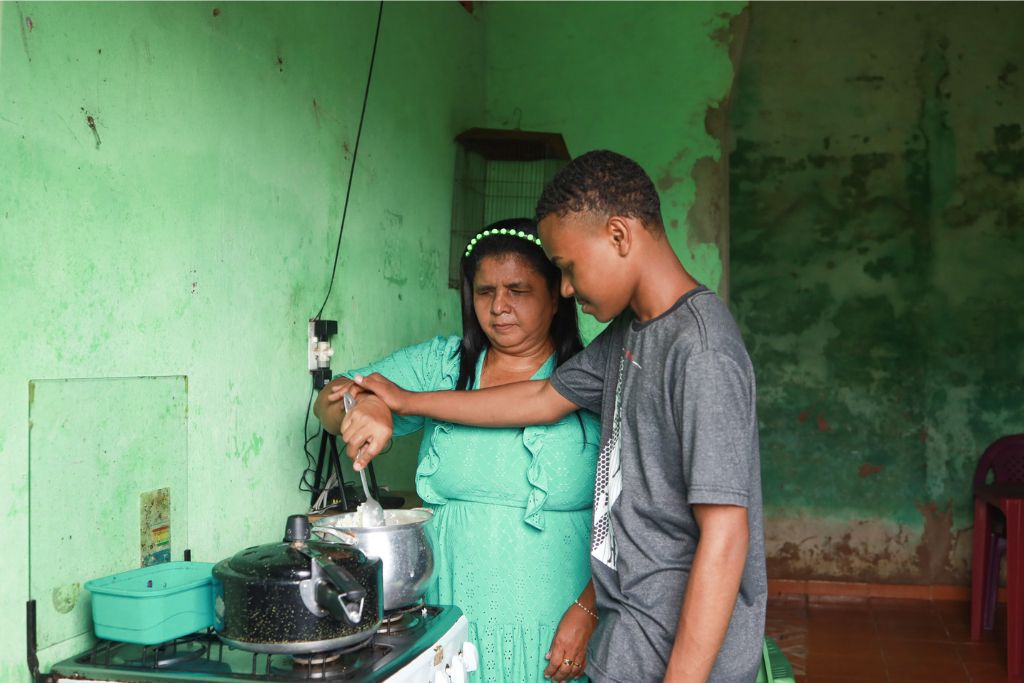 Marcelo cooking with his mum
