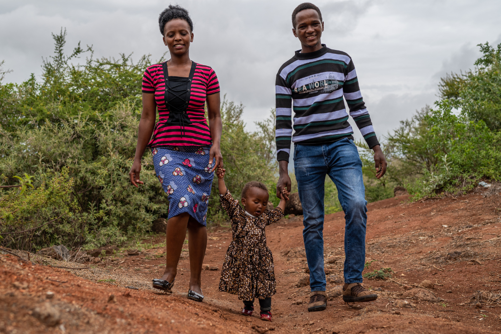 Emmanuel with his wife and daughter